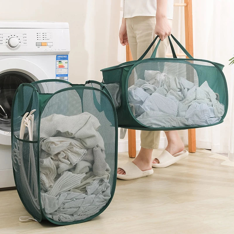 Green mesh laundry hampers filled with clothes near washing machine for easy home organization