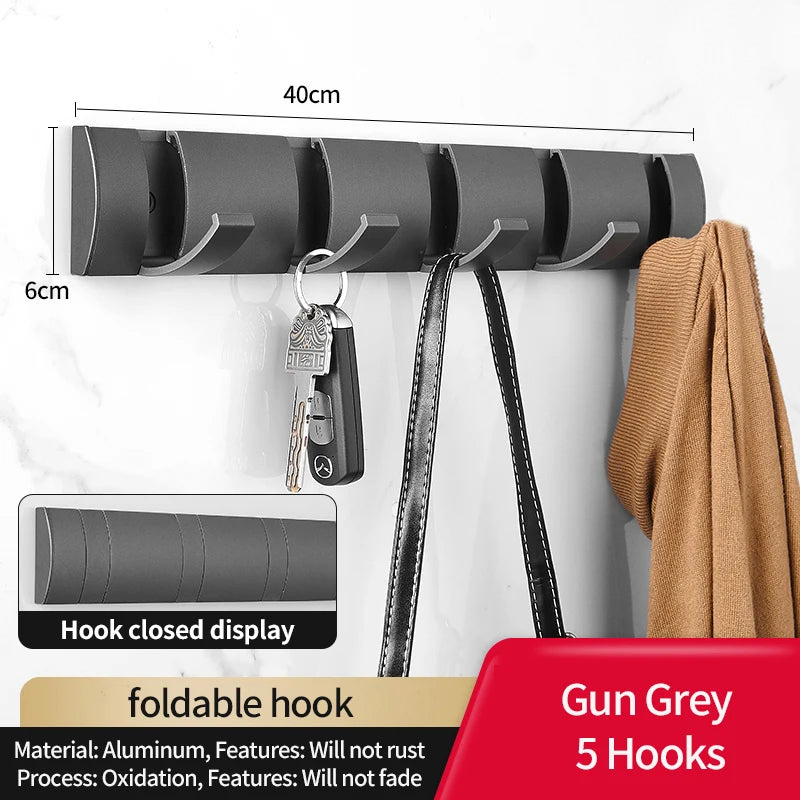 Eprolo folding door hooks towel hanger nail-free wall rack with hooks for hanging towels or clothes, mounted on a wall.