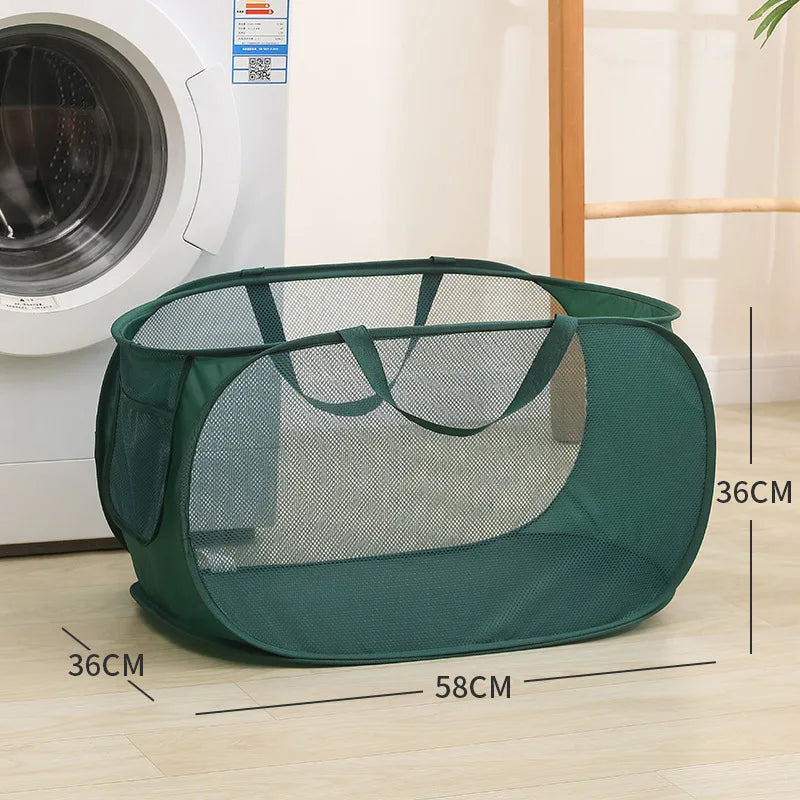 Green mesh laundry basket with handles, 58cm x 36cm, beside washing machine for easy home organization