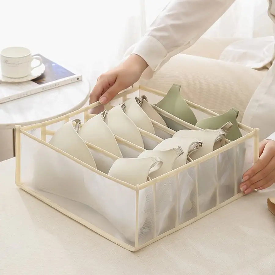 Eprolo house storage box with nylon mesh baby hive drawers, organized in a cabinet for neat toy and clothing storage.