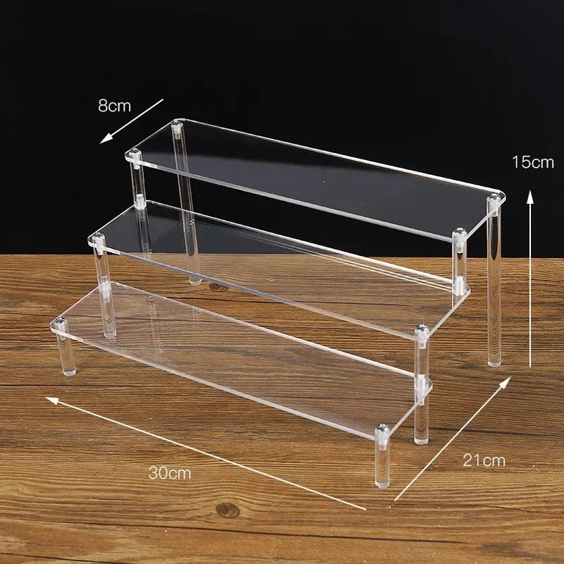 Clear acrylic display stand with 1-5 tiers, ideal for showcasing cupcakes and desserts in a professional bakery setup.