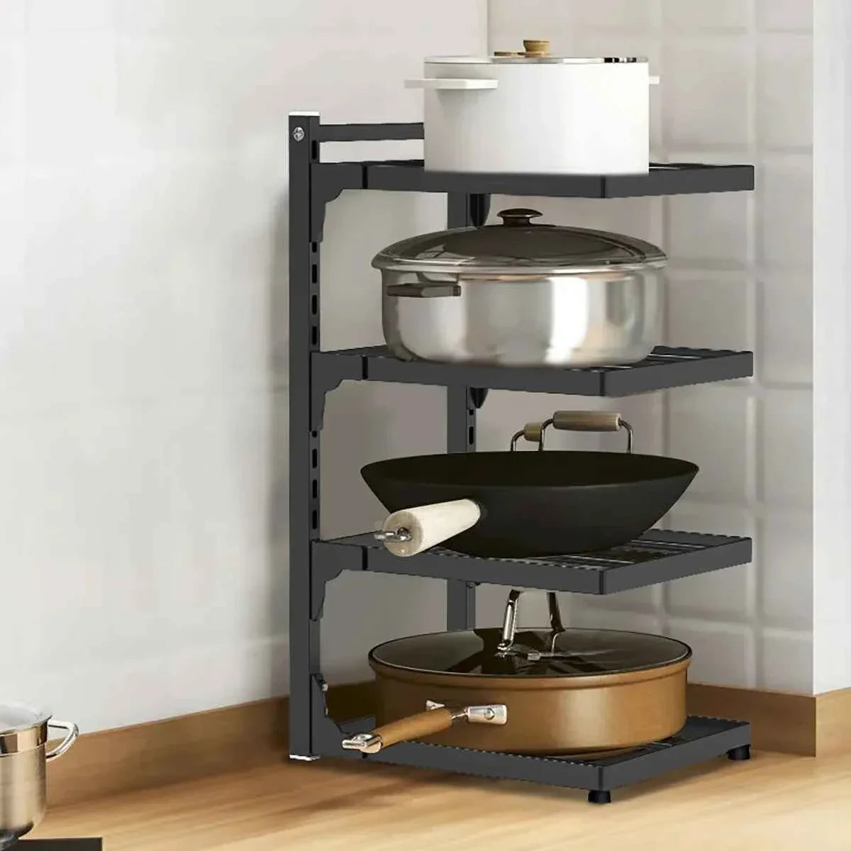 Black 4-tier kitchen pot rack with pots, pans, and wok on shelves, space-saving cookware organizer