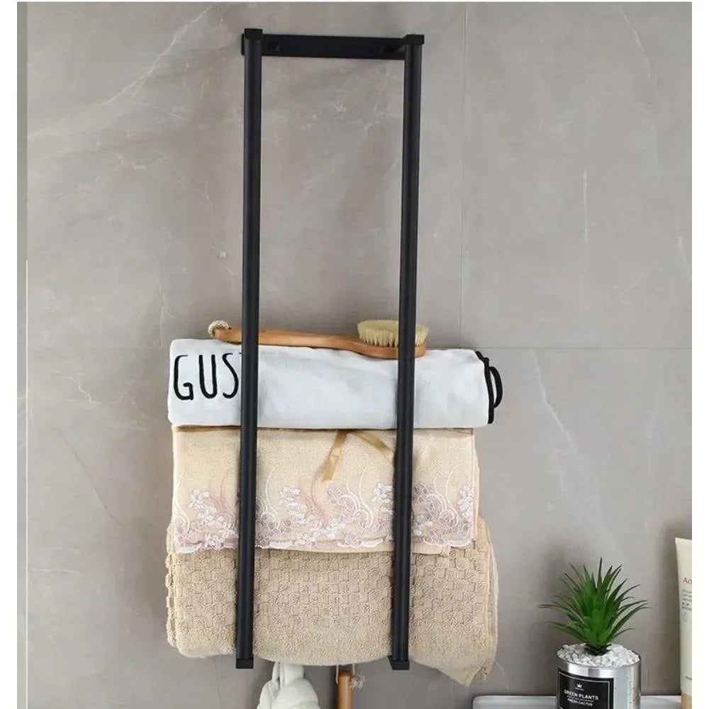 Wall-mounted eprolo bathroom towel rack with rolled towel storage, featuring sleek metal bars for organized bathroom towel display.