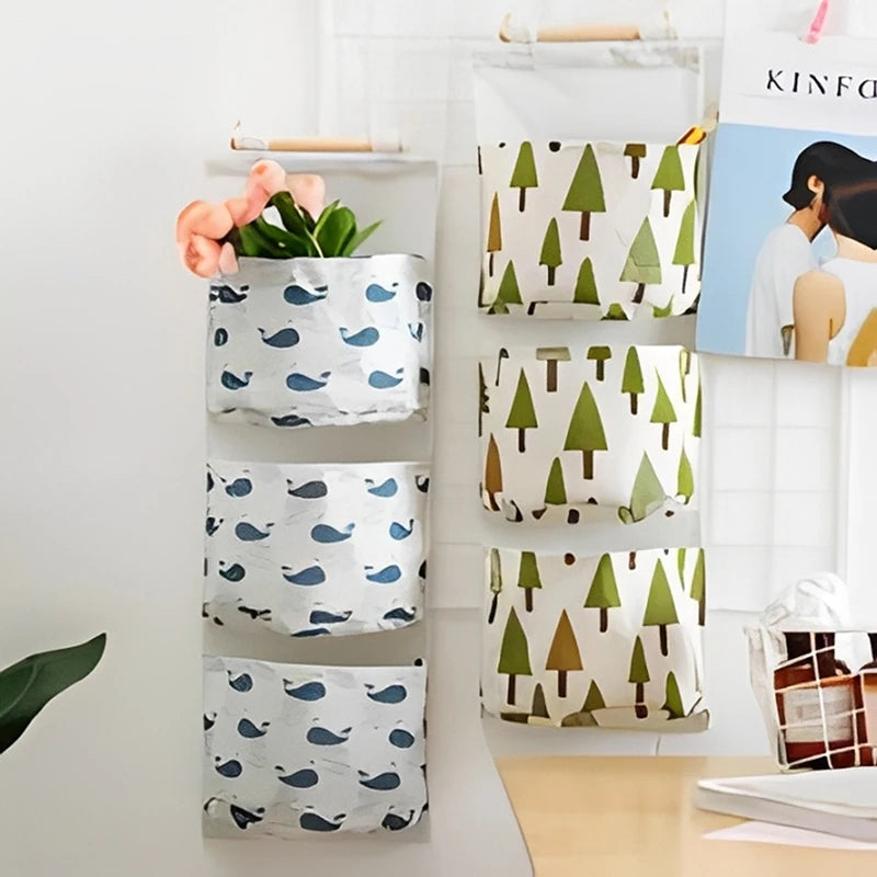 Eprolo dormitory wall hanging storage bag with three pockets for organizing accessories and small items.