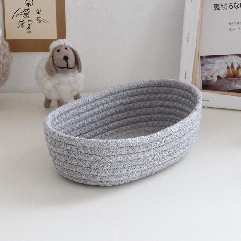 Eprolo Nordic cotton rope woven storage basket for organizing household items, with a natural, durable design and sturdy handles.