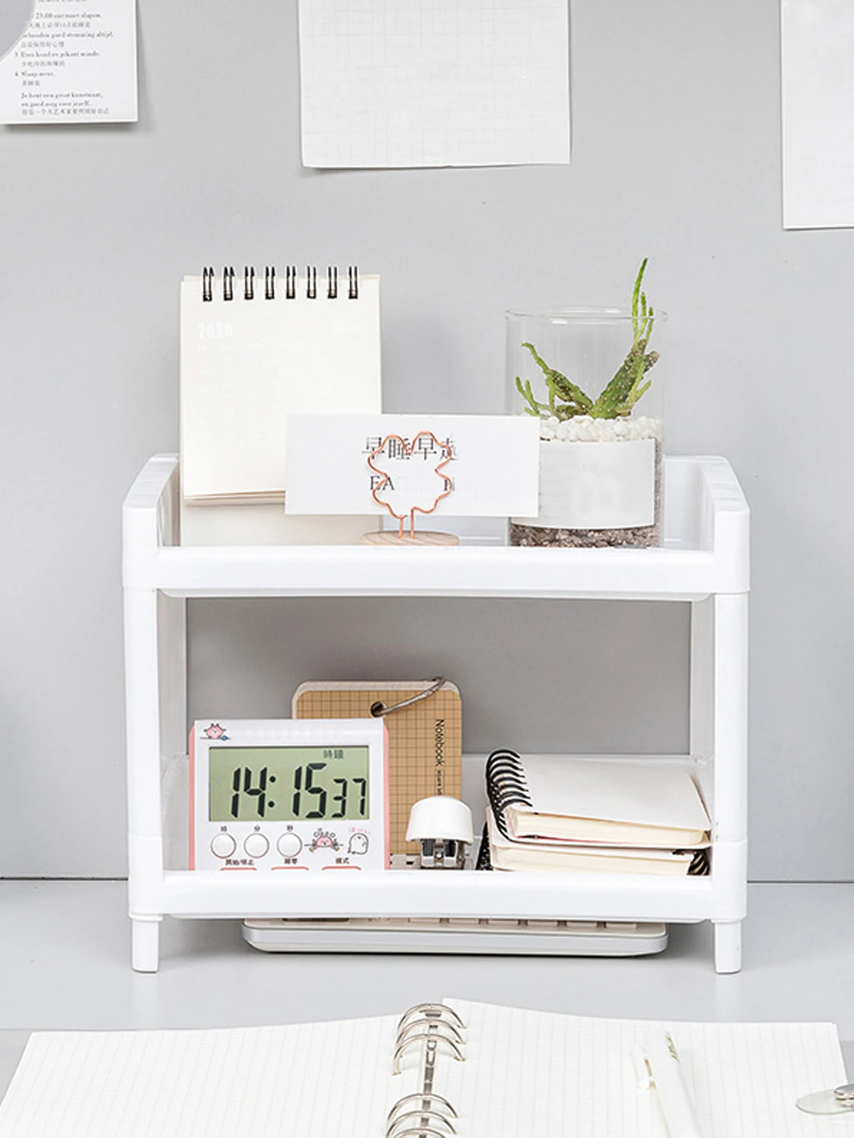 Eprolo minimalist desktop double-layer storage rack for organizing stationery and household items on a clean workspace.