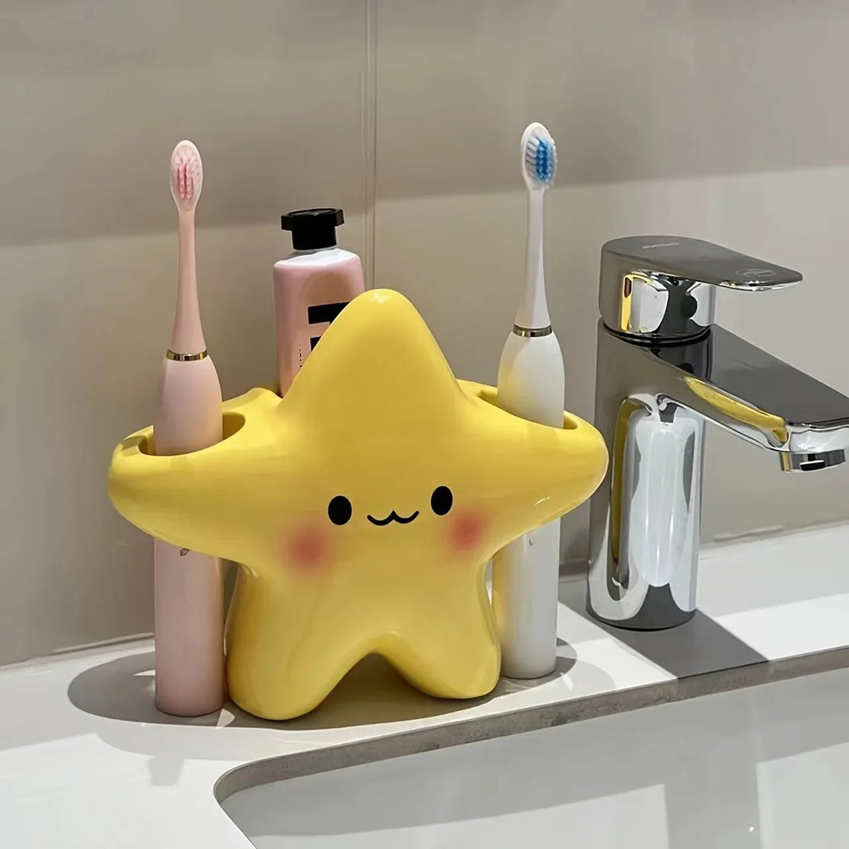 Cute star-shaped toothbrush holder from eprolo, freestanding bathroom organizer with compartments for toothbrushes and toothpaste.