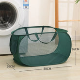 Green mesh laundry basket with handles, 58cm x 36cm, beside washing machine for easy home organization
