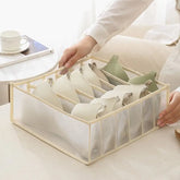 Eprolo house storage box with nylon mesh baby hive drawers, organized in a cabinet for neat toy and clothing storage.