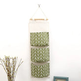 Waterproof hanging closet organizer with three pockets, wall-mounted storage bag featuring bear and flamingo designs by eprolo.