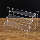 Clear acrylic display stand with 1-5 tiers, ideal for showcasing cupcakes and desserts in a professional bakery setup.
