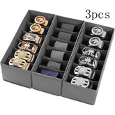 Three black fabric closet organization drawer storage holders from eprolo, shown stacked inside a closet for neat storage.