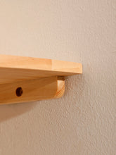 Wood floating wall corner shelf with round end design by eprolo, ideal for corner storage and display.