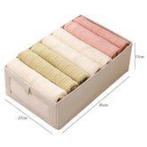 Eprolo wardrobe storage organizer with multiple compartments for T-shirts, jeans, underwear, and pants in a closet drawer.