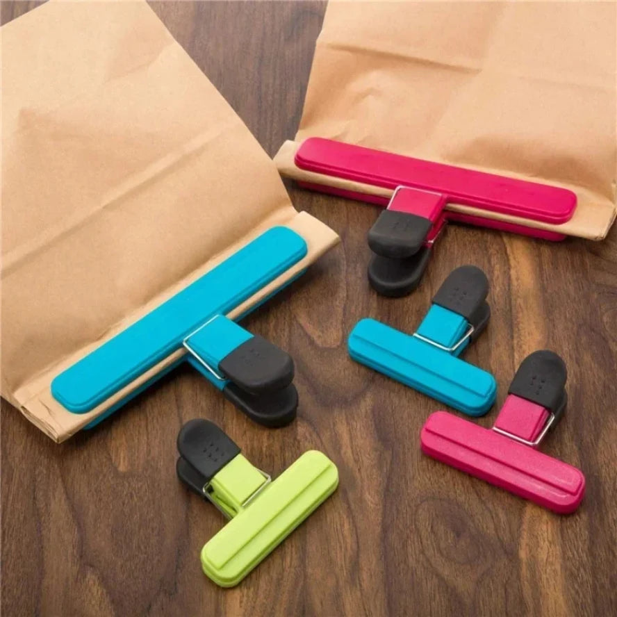 Six eprolo T-type kitchen food sealing clips holding plastic bags for tea, snacks, or food storage.