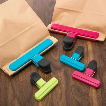 Six eprolo T-type kitchen food sealing clips holding plastic bags for tea, snacks, or food storage.