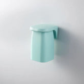 Japanese style minimalist magnetic mouthwash cup wall mount by eprolo, featuring a sleek design and wall attachment for bathroom use.