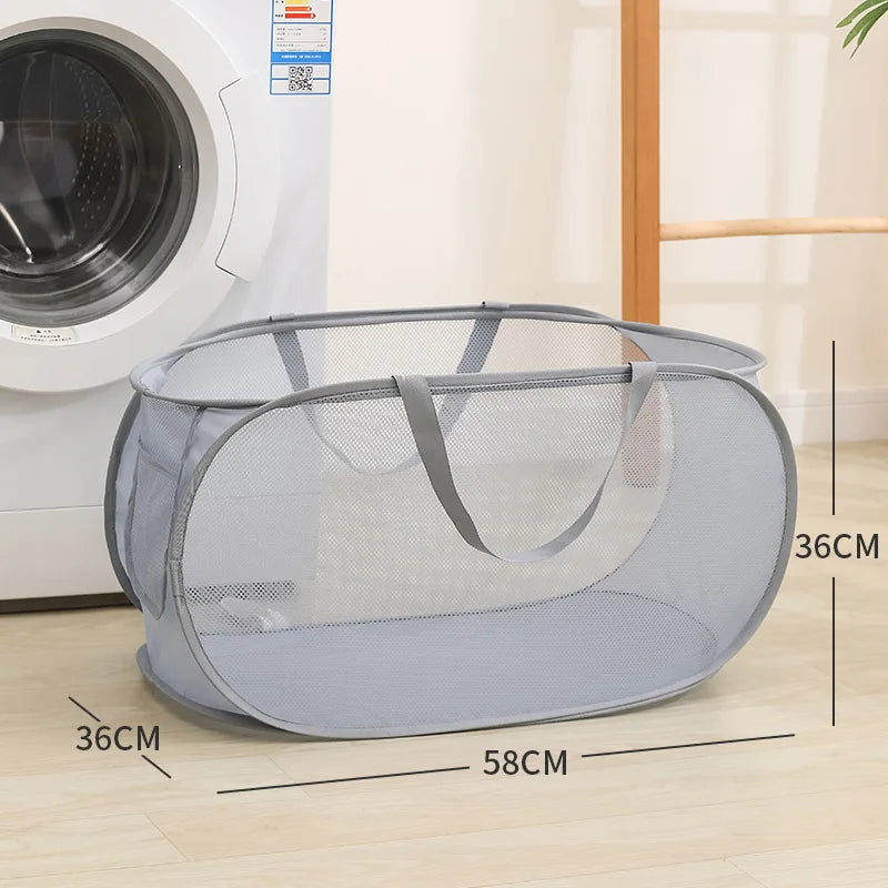 Gray mesh laundry basket with handles, 58x36cm, beside washing machine for easy home organization