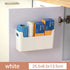 White cabinet door organizer holding plastic wrap, bags, and boxes for kitchen storage