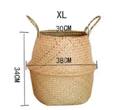 Eprolo seaweed wicker basket rattan hanging flowerpot used for storing dirty clothes, with a natural woven design and hanging loop.