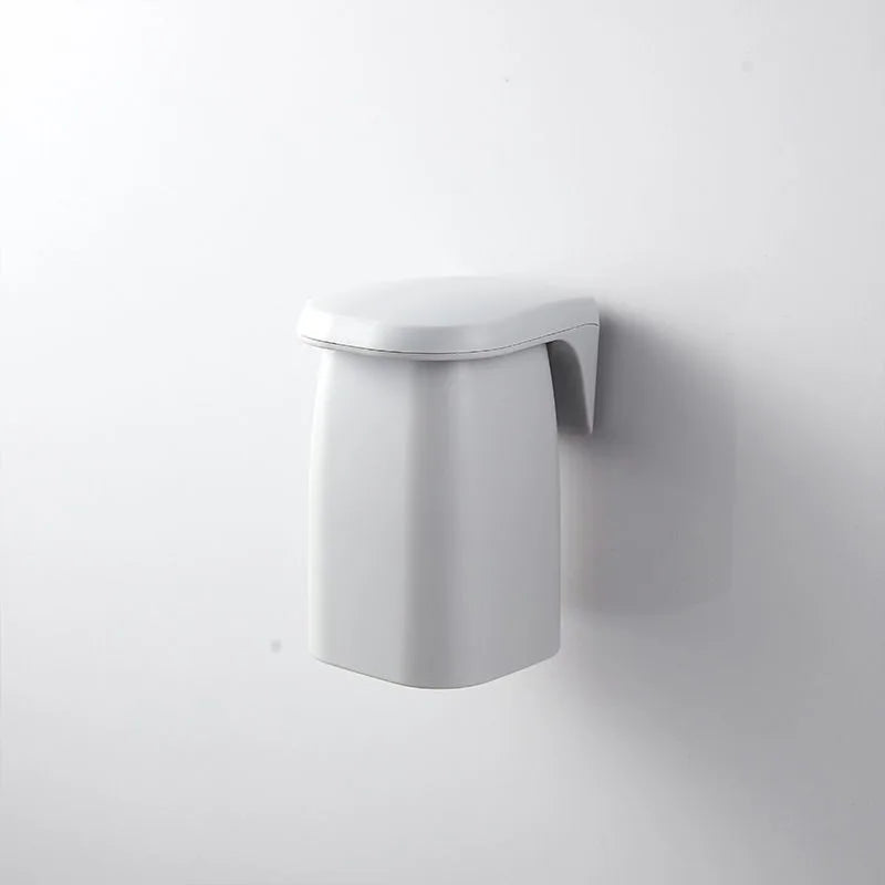 Japanese style minimalist magnetic mouthwash cup wall mount by eprolo, showing a sleek, white ceramic cup attached to a modern wall bracket.