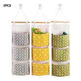Waterproof hanging closet organizer with three pockets, wall-mounted storage bag featuring bear and flamingo designs by eprolo