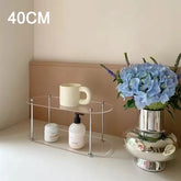 Eprolo Ins Style acrylic storage rack on a desktop with decorative shelves for organization and display.