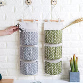 eprolo dormitory wall hanging storage bag with three pockets for home organization and space-saving storage.