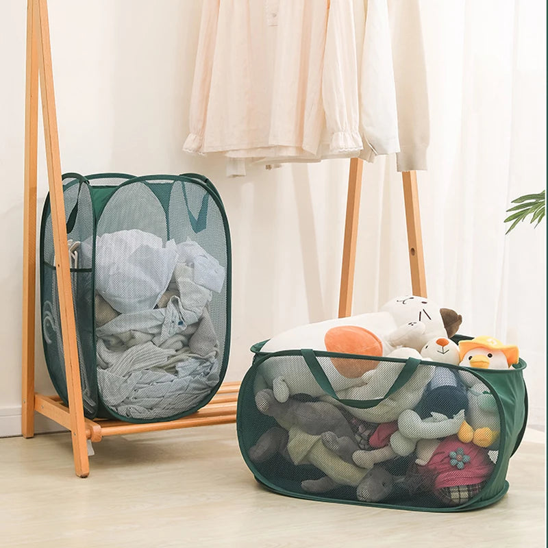 Green mesh laundry hampers with clothes and stuffed toys, ideal for home organization and easy storage.
